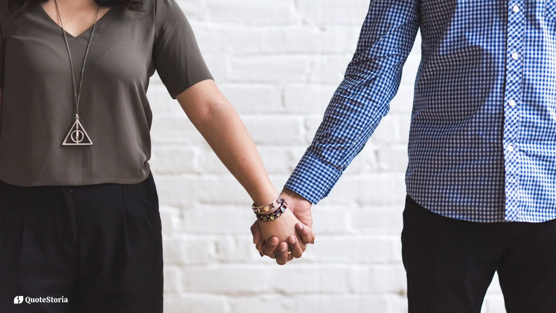 Two hands reaching across distance, connected by a glowing golden thread symbolizing the invisible bonds of love.
